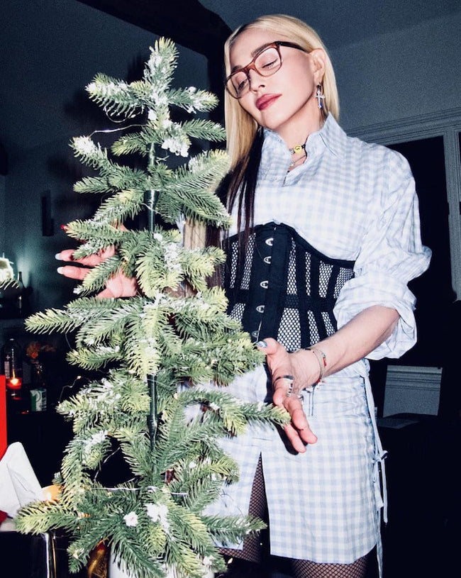 madonna christmas tree dress On December 23, 2025, Madonna slipped into holiday mode with a sultry Santa themed post soundtracked by Santa Baby. With vintage glamour and a knowing wink, the images plays with the same